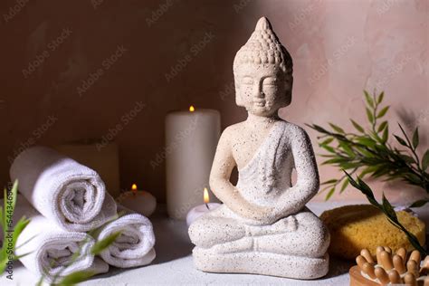 Spa beauty wellness concept with statue of Buddha with burning candles for spa time. Stock Photo ...