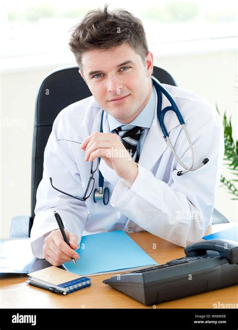 Portrait A Charming Male Doctor Writing Notes Stock Photo Alamy