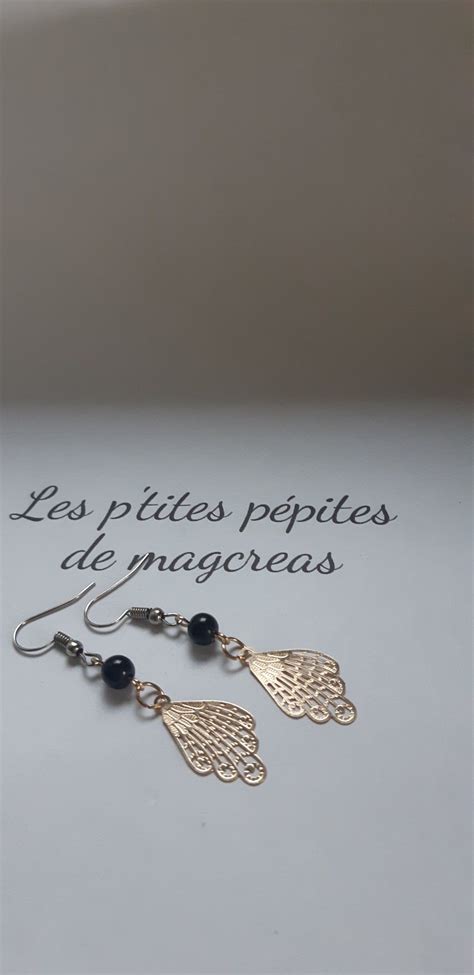 Boucles d oreilles aile d ange doré perle noir argenté Jewelry