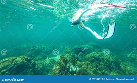 Happy Lifestyle Young Woman In A Swimsuit Snorkeling And Swimming