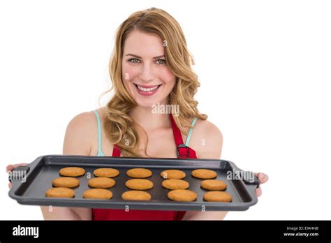 Smiling Woman Showing Hot Cookies Stock Photo Alamy