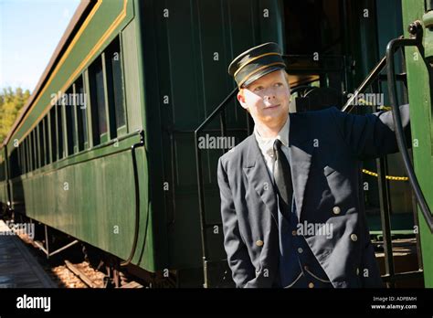 Train conductor on an old-fashioned train Stock Photo, Royalty Free ...