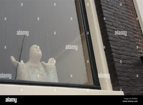 Prayer of a statue Stock Photo - Alamy