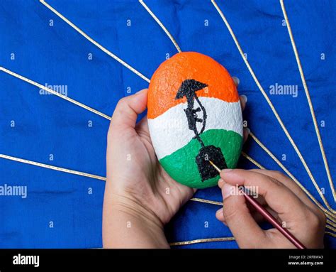 Hand painting stone with brush . Indian flag color with " amar Jawan ...