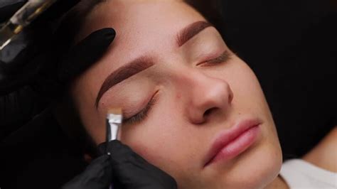 Applying Facial Tinting Cream To A Girls Eyelid Light Permanent