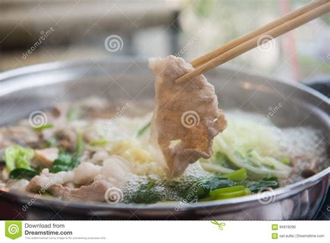 Shabu Shabu Or Sukiyaki Or Hot Pot Hand Holding Pork Using Chopsticks Japanese Food Stock