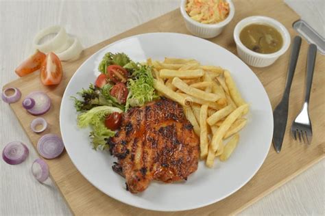 Delicious Plate Of Western Food Chicken Chop With Fries And Salad Stock