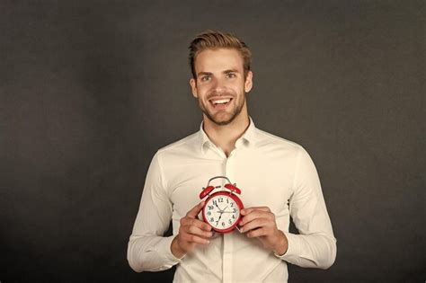 Premium Photo Happy Manager Hold Alarm Clock Business Punctuality