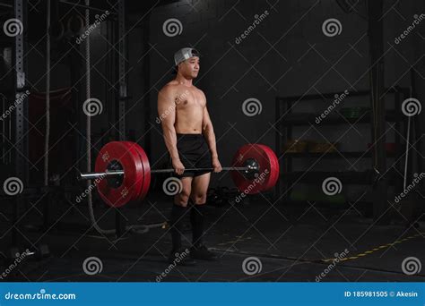 Bodybuilder Woman Barbell Weight Lifting In Gym And Fitness Club Stock