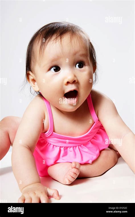 Portrait Of Baby Girl Looking Surprised Stock Photo Alamy