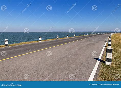 Milestonesblack And White Milestones Roadside With Blue Sky Lake