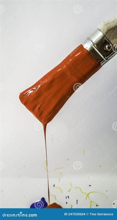 Paintbrush With Red Paint Dripping On White Background Stock Photo