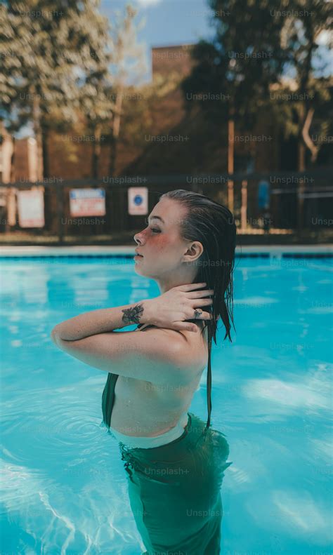 A Woman In A Bathing Suit In A Swimming Pool Photo Style Image On Unsplash