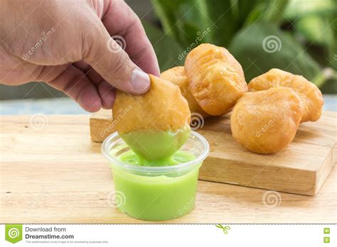 Deep Fried Dough Bun Dip In Pandan Custard Stock Photo Image Of