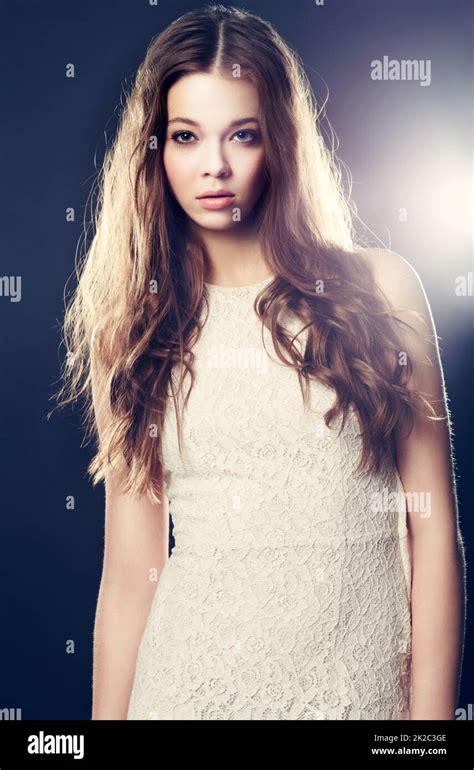 Beauty In The Spotlight A Gorgeous Young Woman Backlit With Bright