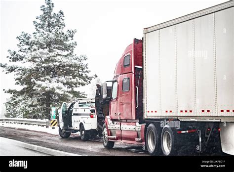 Broken Big Rig Semi Truck With Open Hood And Semi Trailer Standing Out