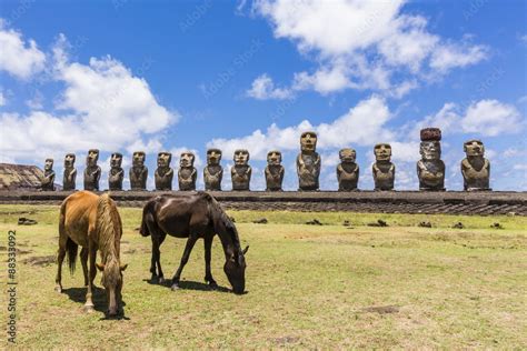 Horses Grazing At The 15 Moai Restored Ceremonial Site Of Ahu Tongariki