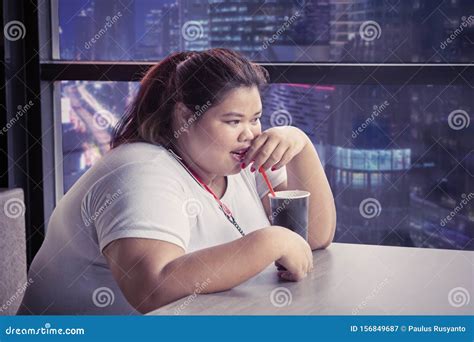 Overweight Woman Enjoying A Glass Of Cola Stock Image Image Of