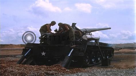 Soldiers load and fire from an M107 Self Propelled 175mm howitzer in ...