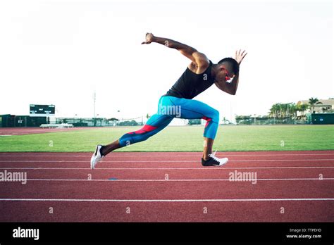 Side View Of Determined Male Athlete Running On Field Stock Photo Alamy