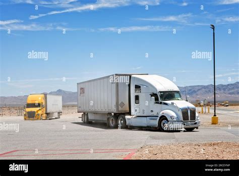 Kenworth And Freightliner American Semi Conventional Trucks At A Truck