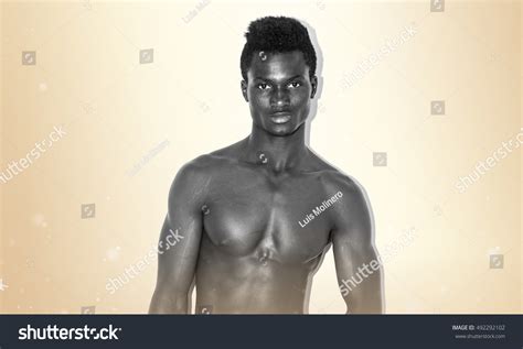 Naked Black Man Over Ocher Background Stock Photo Shutterstock