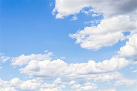 Premium Photo White Clouds In A Bright Blue Sky The Beauty Of The