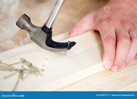 Removing Nail From Wooden Plank Using Hammer Stock Image Image Of