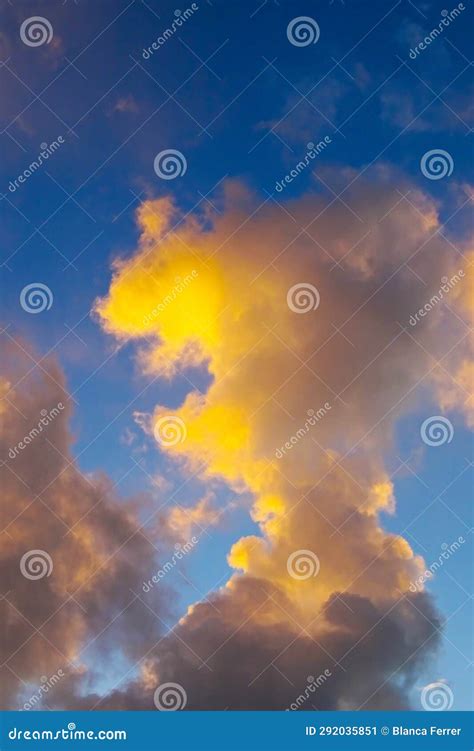 Beautiful And Dramatic Sky At Sunset With Cumulus Clouds Stock Image