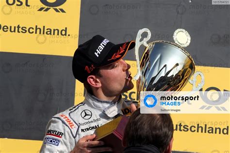 Race Winner Jamie Green GBR AMG Mercedes Celebrates With His Trophy