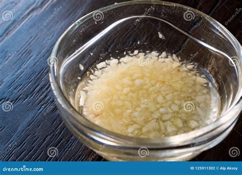 Turkish Style Chopped Garlic Sauce For Soups In Glass Cup Stock Photo