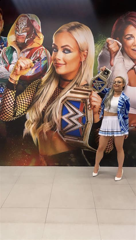 Posing next to her Clash at the Castle Wall Mural : r/LivMorgan