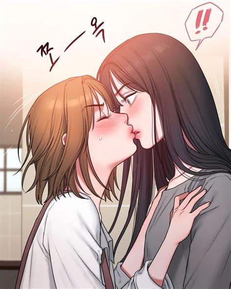 Two Women Kissing Each Other In Front Of A Window