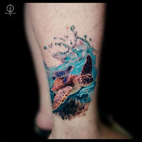 A Tattoo On The Leg Of A Person With A Sea Turtle And Wave Coming Out Of It