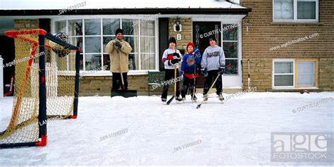 Kids Playing Ice Hockey Outdoors, Stock Photo, Picture And Royalty Free ...