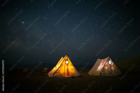 Camping under stars, night sky in the desert, the Milky Way, tents ...