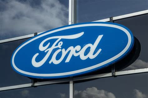 Ford Logo at the Car Dealer Store. Ford Store is a Representative of the American Auto Brand ...