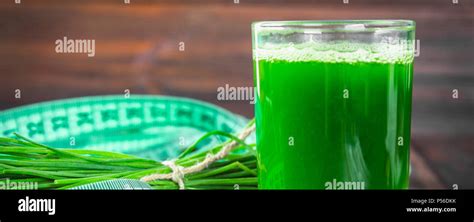 Wheatgrass Shot Juice From Wheat Grass Trend Of Health Stock Photo