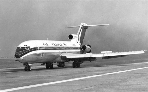 An Air France Airplane Is On The Runway At An Airport In Black And