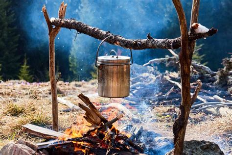 Cooking In A Pot Over Campfire Cooking Porridge In The Hike Stock