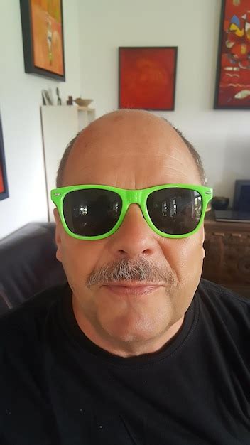 Premium Photo Portrait Of Man Wearing Sunglasses At Home