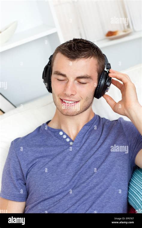 Relaxed Young Man Listening To Music With Headphones Stock Photo Alamy