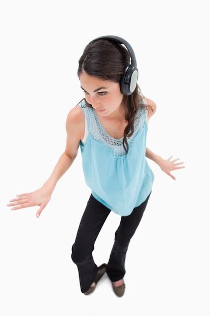 Premium Photo Portrait Of A Happy Woman Dancing While Listening To Music