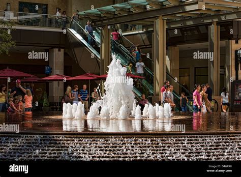 Water fountain shopping mall. Decorative fountain with dancing water in a new urban city center ...