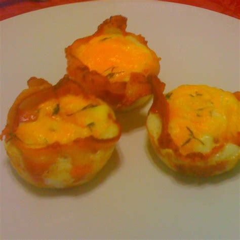 Bacon Wrapped Eggs Cook Bacon And Line Inside Muffin Pan Pour Egg In And Top With Cheese Or