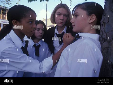 school girl being bullied by a gang of girls Stock Photo - Alamy