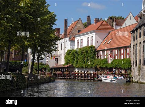 Canal boat tour Bruges, Brugge, Belgium Stock Photo - Alamy