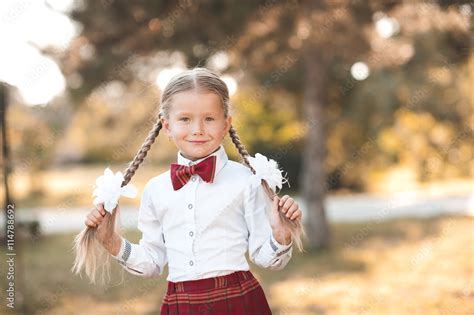 Smiling Pupil Girl 6 7 Year Old Posing Outdoors Wearing School Uniform