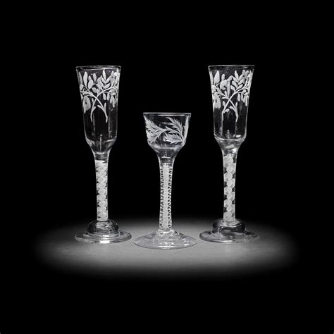 Bonhams A Pair Of Engraved Opaque Twist Ale Flutes And A Wine Glass Circa 1765