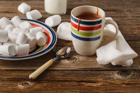 A Messy Cup With Hot Chocolate Whipped Cream Marshmallows And Stock
